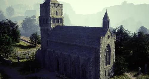 Historic Stone Church Surrounded By Misty Hills at Dawn in a Serene Landscape