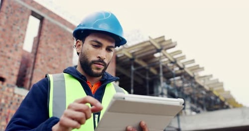Man, typing or tablet on construction site for planning, building project or happy for progress