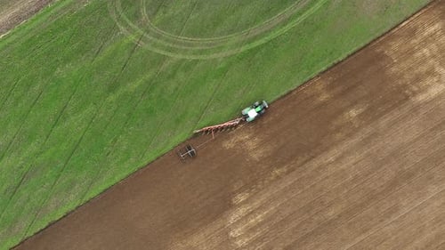 Aerial view of tractor ploughing in Brandenburg, Germany.