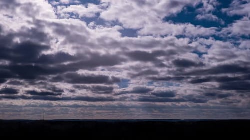 Clouds Rolling Across Blue Sky in Time-Lapse