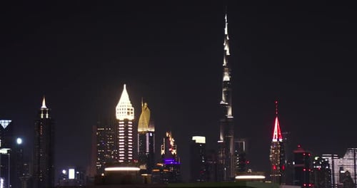 Dubai skyscrapers and Burj Khalifa at night