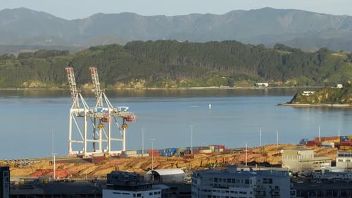 Port Cranes and Shipping Containers on Waterfront