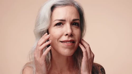 Woman Massaging Face for Skincare Routine