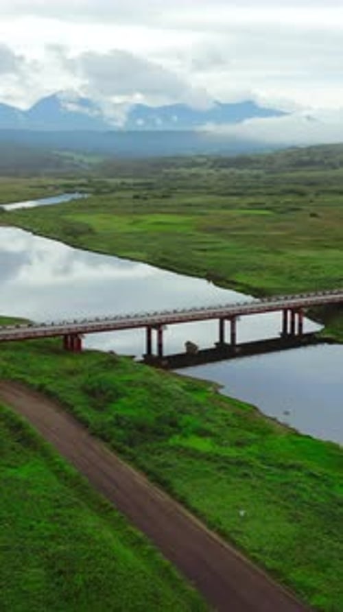 Summer Aerial View of the Narrow River Flowing Into the Sea Clip Concrete Bridge Crossing Calm River