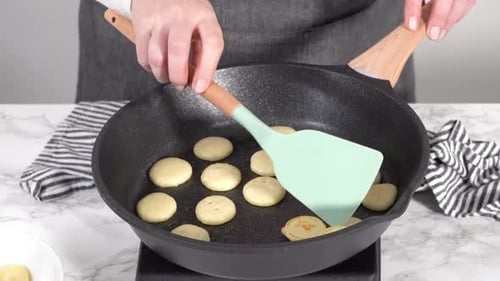Step By Step Frying Mini Pancake Cereal in a Nonstick Frying Pan