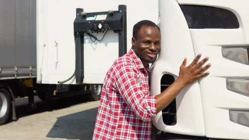 Black Trucker Hugging His Truck Vehicle for Transportation Happy African Truck Driver Loving His Job