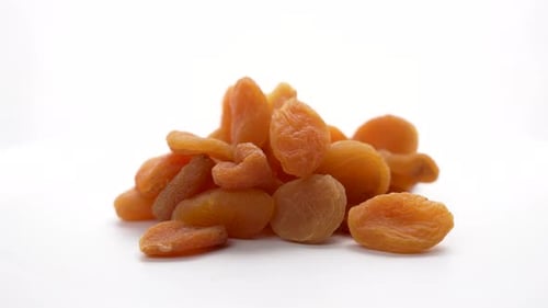 Dried Apricots in a Pile on White Background