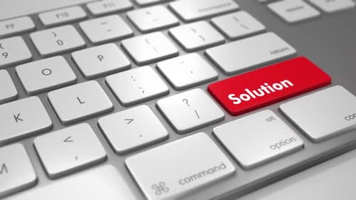 Finger Pressing Red Solution Key on White Computer Keyboard