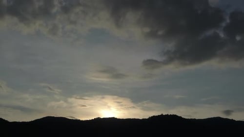Mountain Sunset with Cloudy Sky at Dusk