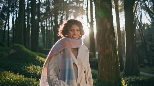 Girl Standing Garden Sunlight in Chic Scarf Exuding Happiness and Style Closeup
