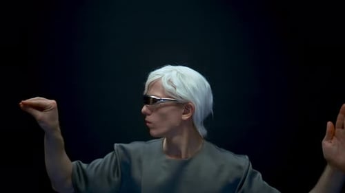 Young Man with White Hair Gesturing with Hands