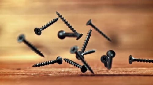 Super Slow Motion Selftapping Screws Fall on the Table