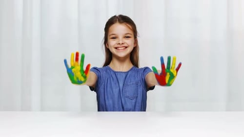 Education, School, Creativity, Art and Painting Concept - Smiling Little Student Girl