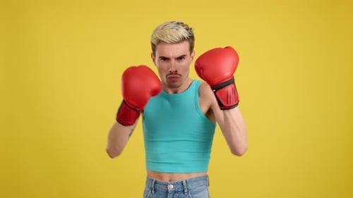 Confident Young Adult Boxes with Red Gloves