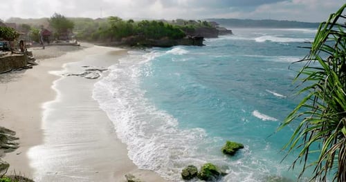 Tropical Sandy Beach with Blue Ocean Waves in Paradise Island with Morning Sunlight
