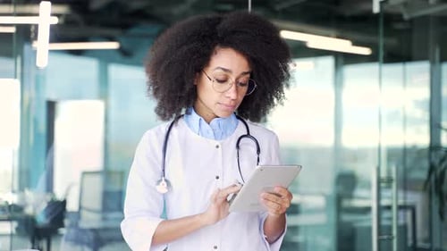 Doctor Using Tablet in Modern Medical Office