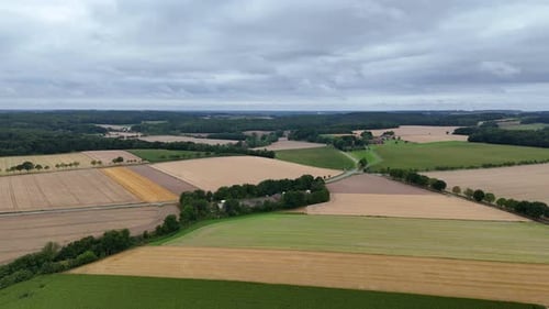 Mystic clouds at sky of American countryside. Farm fields and rolling hills in distance. Quiet and p