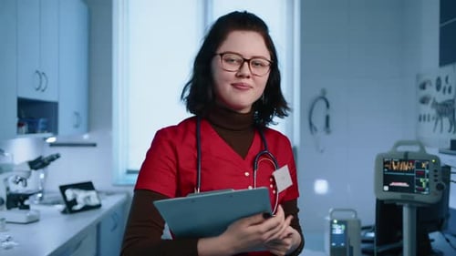 Close Up of Young Female Vet in Glasses Stethoscope and Prescription Template