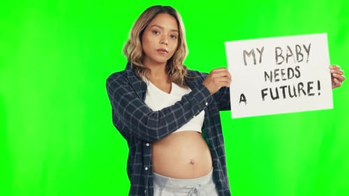 Activism, sign and woman in a studio with green screen for a pregnancy protest or march