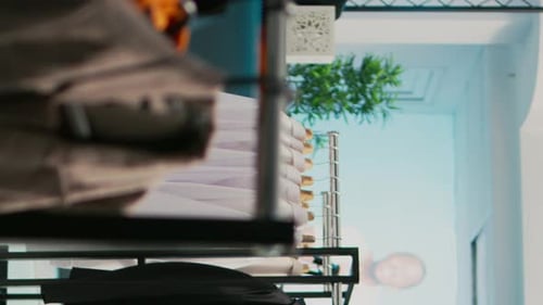 Vertical Video Female Customer Looking at Merchandise in Clothing Store