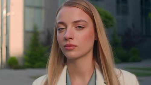 Smiling Woman in Blazer Portrait Outside City Building