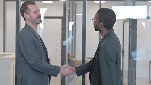 Multi Ethnic People Shaking Hand in Office