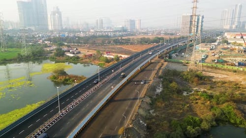 Highway entering from the outskirts to Mumbai India city center, air pollution obscures the sky