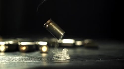 Cartridges From a Pistol Shot Fall to the Floor Filmed on a Highspeed Camera at 1000 Fps