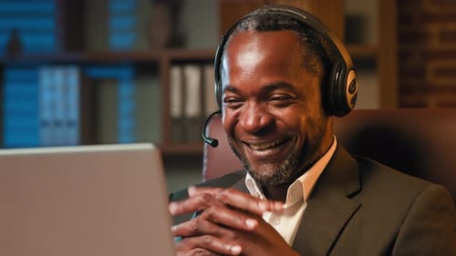 Adult Man Video Conferencing at Home Office