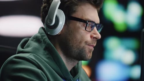 Closeup Coder Hands Typing Keyboard in Night Data Center Man Enjoying Music