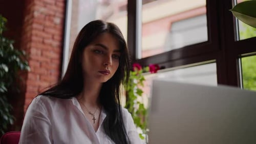 Young Beautiful Brunette Woman Working With Laptop In Cafe Portrait Of Female Freelancer