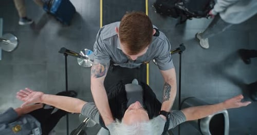 Diverse People Passing Through Xray Metal Detector Scanner Airport Worker Checking Passengers