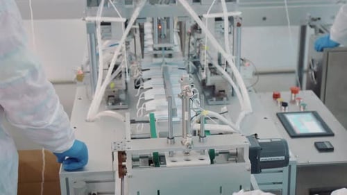 Workers Manufacturing Surgical Masks on Assembly Line