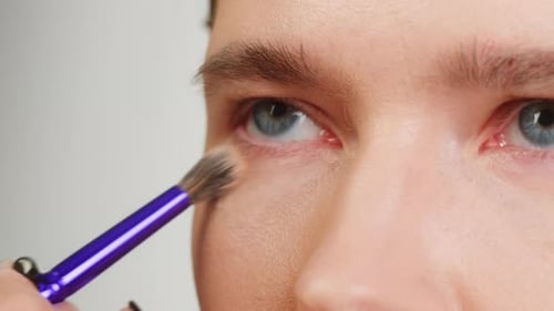 Beauty Shot of Woman Makeup Artist Applying Foundation Bb Cream on Previously Applied Moisturizing
