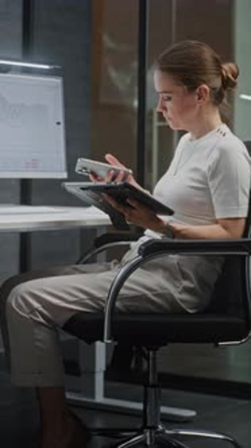 Female Financial Analyst Monitoring Exchange Market Charts on Multiple Digital Devices and Computer