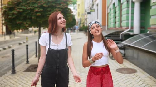 Women Walking and Talking Together in an Urban Setting