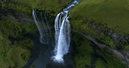 Aerial View Of Seljalandsfoss Waterfall Cascading In Southern Region Of Iceland. orbiting shot
