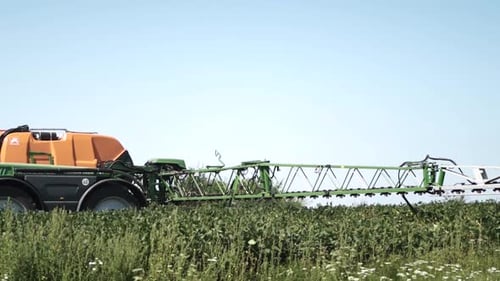 Spray Fertilize On Field With Chemicals In Agriculture Field