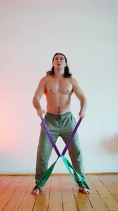 Muscular Man Working Out With Resistance Band