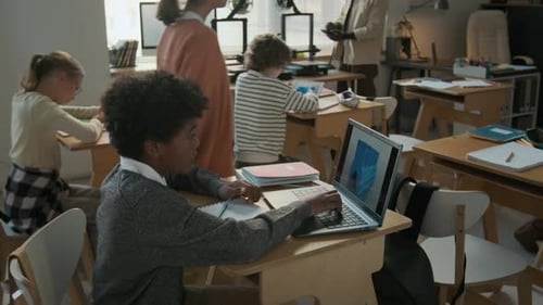 Students Working on Computers in Modern Classroom