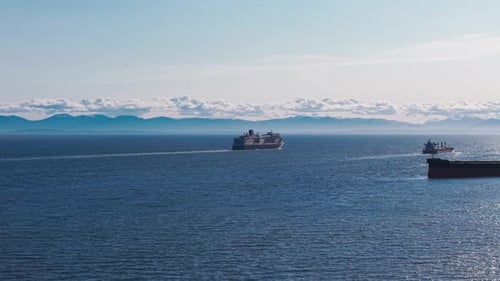 A scenic shot of a cruise ship sailing on the beautiful seas of west vancouver.