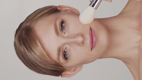Studio Portrait of Young Beautiful and Natural Blond Woman Face Lifting Cosmetics and Makeup Concept