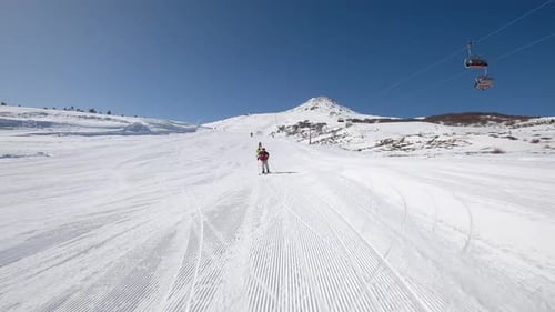 People Skiing On Snowy Mountain