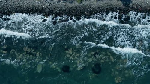 Sea Waves Crashing and Foaming on Empty Rocky Shore