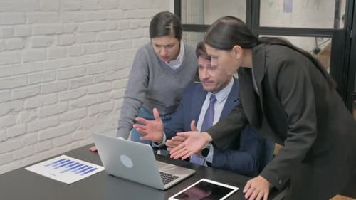 Business Team Faces Problem at Office Desk