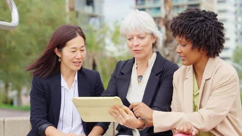 Business Multiethnic People Financial Businesswomen Having Conversation While Using Tablet Outside