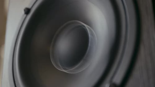 Speaker cone in out pumping from bass sound. Vibrating loud sound speaker. Loopable.