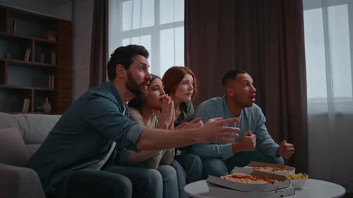 Friends watch sports, celebrate win at home