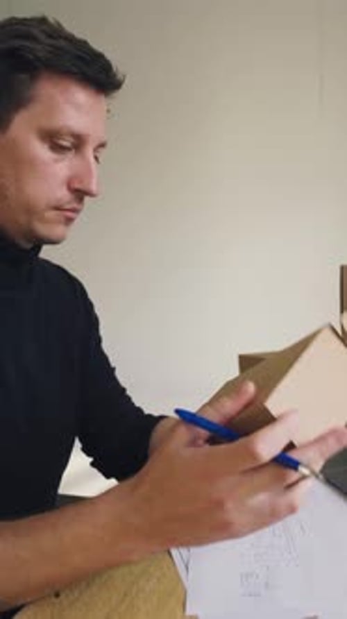 Designer Works Develops Packaging Design Using Computer and Drawing Designer Develops the Design of