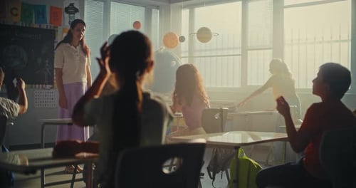 Primary School Children Preparing for Lesson Laying Out School Supplies on Desks